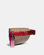 COACH®,BELT BAG WITH SIGNATURE CANVAS DETAIL AND SOUVENIR PINS,Coated Canvas,Pewter/Tan Red Apple,Angle View