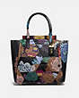 COACH®,TROUPE TOTE IN SIGNATURE CANVAS WITH PATCHWORK KAFFE FASSETT PRINT,pvc,Medium,Brass/Tan Multi,Front View