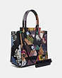 COACH®,TROUPE TOTE IN SIGNATURE CANVAS WITH PATCHWORK KAFFE FASSETT PRINT,pvc,Medium,Brass/Tan Multi,Angle View