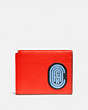 COACH®,TRIFOLD CARD WALLET IN COLORBLOCK WITH COACH PATCH,Red Orange Multi,Front View