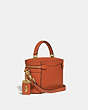 COACH®,TRAIL BAG,Leather,Brass/Vermillion,Angle View