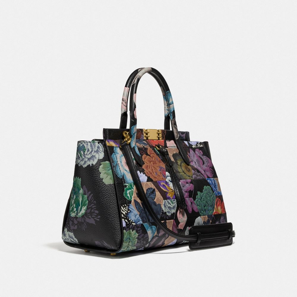 COACH®,TROUPE CARRYALL 35 IN SIGNATURE CANVAS WITH KAFFE FASSETT PRINT,pvc,Large,Brass/Tan Multi,Angle View