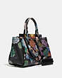 COACH®,TROUPE CARRYALL 35 IN SIGNATURE CANVAS WITH KAFFE FASSETT PRINT,pvc,Large,Brass/Tan Multi,Angle View