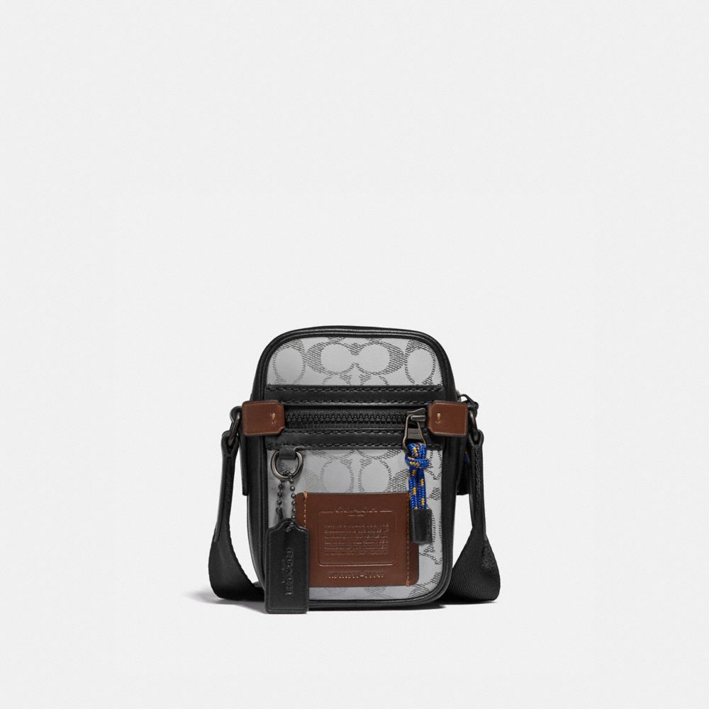 COACH®,DYLAN 10 IN REFLECTIVE SIGNATURE CANVAS,Signature Coated Canvas/Smooth Leather,Black Copper/Silver,Front View