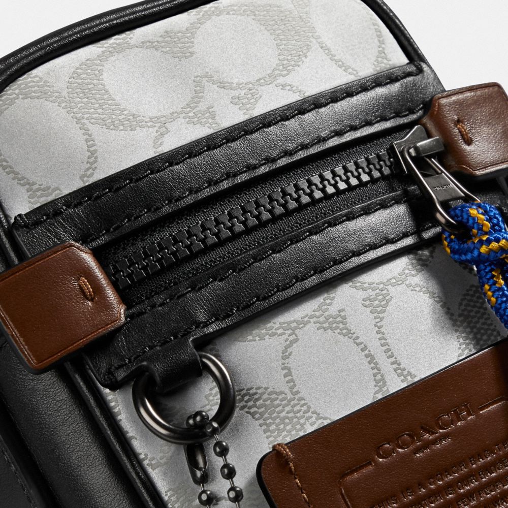 COACH®,Dylan 10 In Reflective Signature Canvas,,Closer View