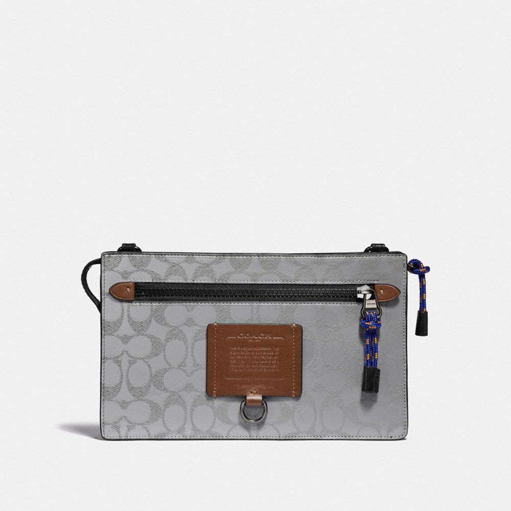 COACH®,RIVINGTON CONVERTIBLE POUCH IN REFLECTIVE SIGNATURE CANVAS,pvc,Mini,Silver/Saddle/Black,Front View image number 0