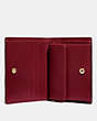 COACH®,SMALL SNAP WALLET,Pebble Leather,Brass/Deep Red,Inside View,Top View