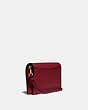 COACH®,HAYDEN FOLDOVER CROSSBODY CLUTCH,Leather,Mini,Brass/Deep Red,Angle View
