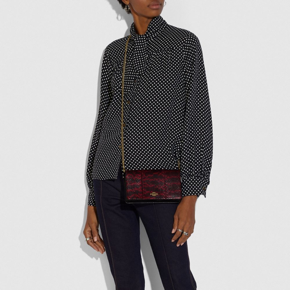 Callie Foldover Chain Clutch In Blocked Snakeskin