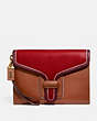 COACH®,COURIER WRISTLET IN COLORBLOCK,Leather,Mini,Brass/Red Apple Multi,Front View