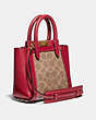 COACH®,TROUPE TOTE 16 IN SIGNATURE CANVAS,Coated Canvas,Medium,Brass/Tan Red Apple,Angle View