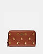 COACH®,MEDIUM ZIP AROUND WALLET WITH APPLE PRINT,Leather,Mini,Brass/Saddle Multi,Front View
