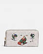 COACH®,ACCORDION ZIP WALLET IN SIGNATURE CANVAS WITH REXY,Signature Coated Canvas,Mini,Brass/Ivory Multi,Front View