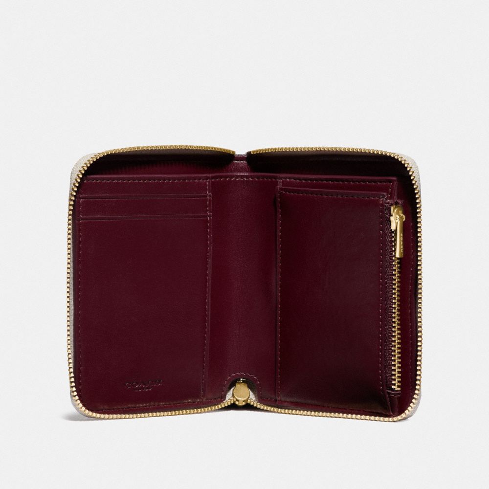 Small zip around 2025 wallet in signature leather