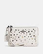 COACH®,SMALL WRISTLET WITH STAR RIVETS,Leather,Chalk/Dark Gunmetal,Front View