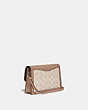 COACH®,DREAMER CONVERTIBLE CROSSBODY IN COLORBLOCK SIGNATURE CANVAS,pvc,Mini,Light Antique Nickel/Sand Taupe,Angle View