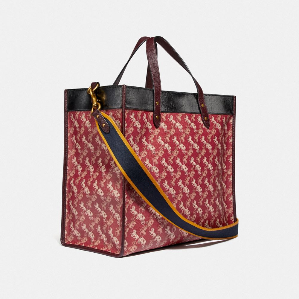 COACH®,FIELD TOTE 40 WITH HORSE AND CARRIAGE PRINT AND VARSITY STRIPE,Coated Canvas/Pebble Leather,Large,Brass/Red Black Multi,Angle View