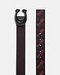 COACH®,SIGNATURE BUCKLE REVERSIBLE BELT WITH HORSE AND CARRIAGE PRINT, 38MM,Coated Canvas/Pebble Leather,BLACK/RED,Angle View