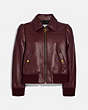 COACH®,LEATHER TAILORED BOMBER JACKET,Leather,Cranberry,Front View