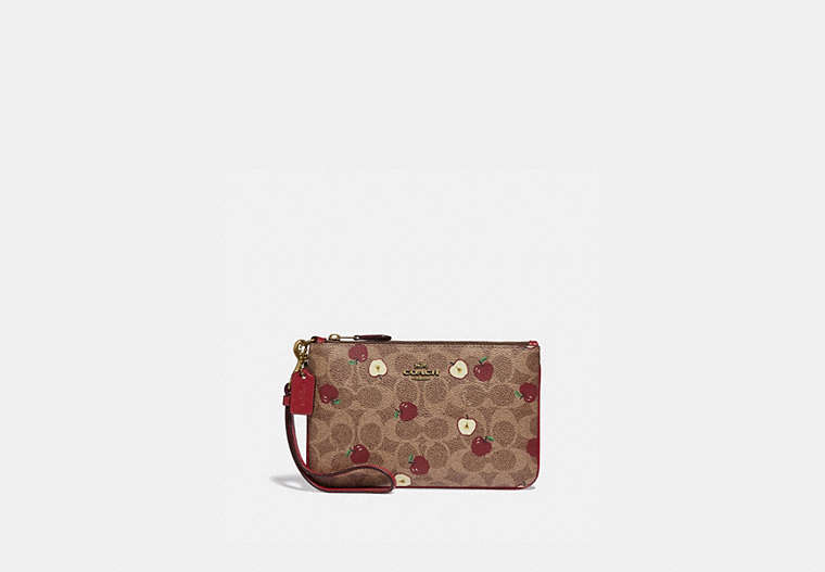COACH®,SMALL WRISTLET IN SIGNATURE CANVAS WITH SCATTERED APPLE PRINT,Signature Coated Canvas,Brass/Tan Multi,Front View