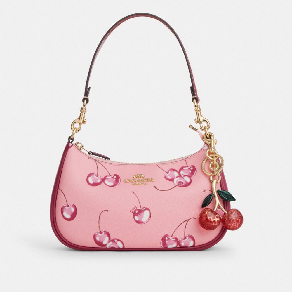 COACH®,BRELOQUE DE SAC SIGNATURE CERISE,résine,Or/Rose multi,Angle View