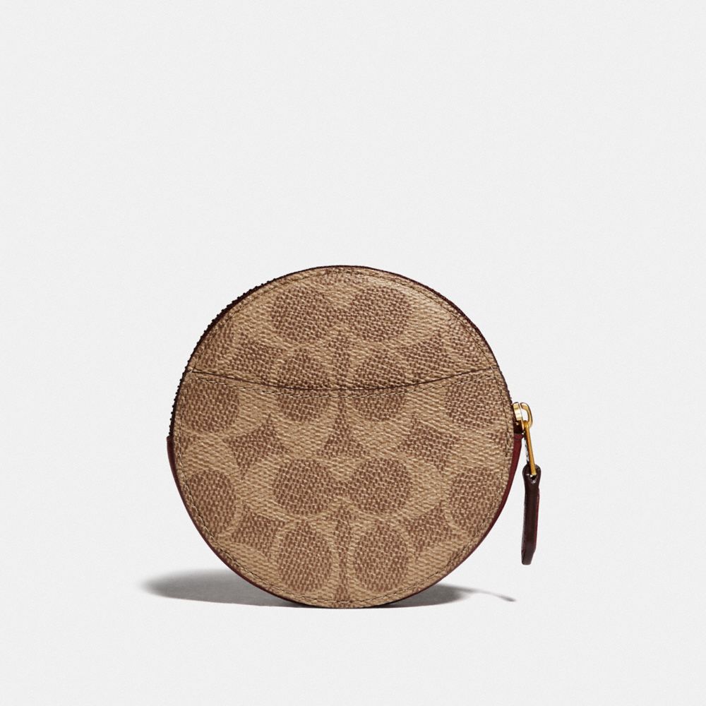 Coach round store coin purse