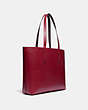 COACH®,HIGHLINE TOTE WITH REXY AND CARRIAGE,Pebble Leather,Large,Brass/Deep Red Multi,Angle View