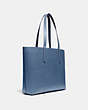 COACH®,HIGHLINE TOTE WITH REXY AND CARRIAGE,Pebble Leather,Large,V5/Stone Blue Multi,Angle View