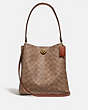 COACH®,CHARLIE BUCKET BAG IN SIGNATURE CANVAS,pvc,Medium,Brass/Tan/Rust,Front View
