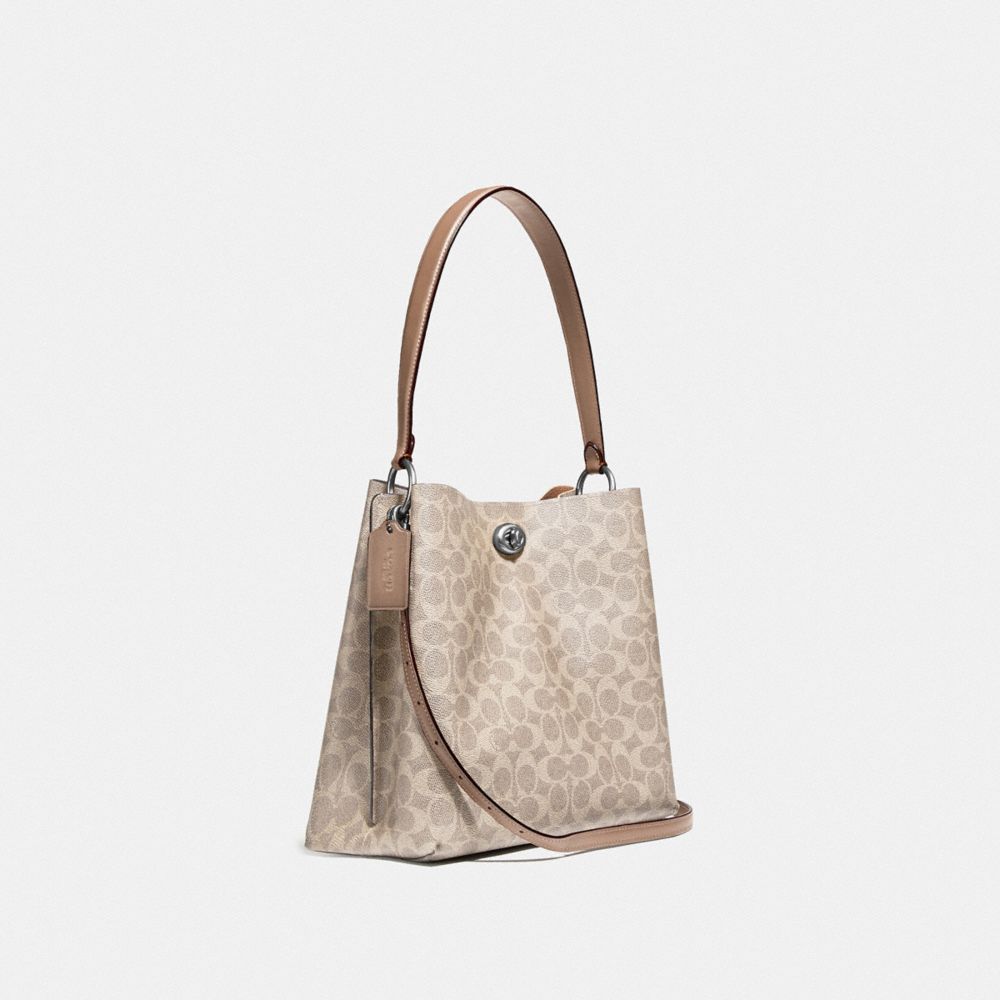 COACH®,SAC SEAU CHARLIE EN TOILE SIGNATURE,PVC,Nickel patiné pâle/Sable/Taupe,Angle View