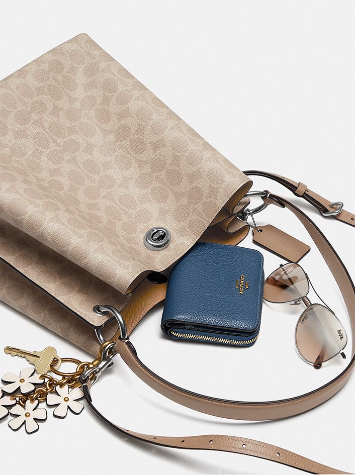 COACH®,Charlie Bucket Bag In Signature Canvas,,Angle View