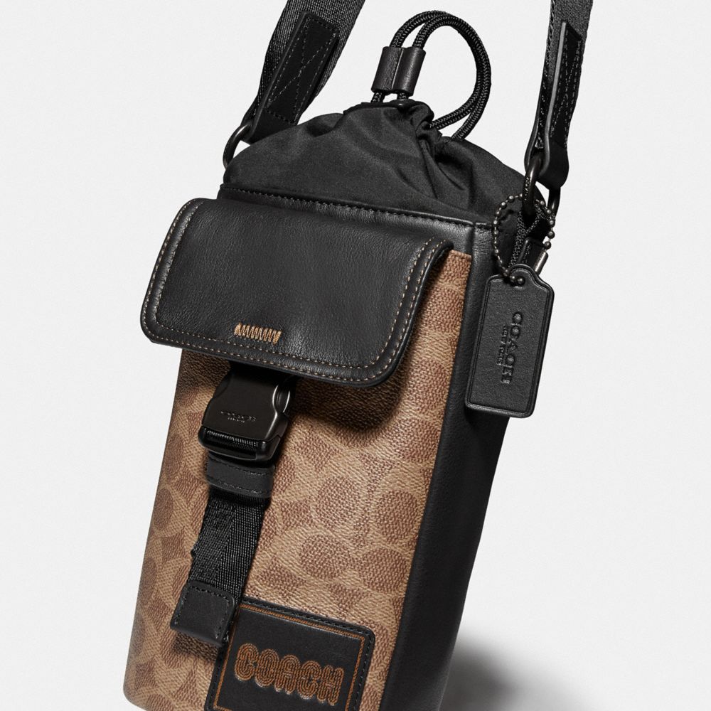 Pacer crossbody in signature canvas with coach discount patch