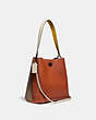COACH®,CHARLIE BUCKET BAG IN COLORBLOCK,Pebble Leather,Pewter/Ginger Multi,Angle View