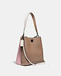 COACH®,CHARLIE BUCKET BAG IN COLORBLOCK,Pebble Leather,V5/Aurora Multi,Angle View