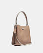 COACH®,CHARLIE BUCKET BAG 21 IN BLOCKED SIGNATURE CANVAS,Pebble Leather,Small,Light Antique Nickel/Sand Taupe,Angle View