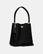 COACH®,CHARLIE BUCKET BAG 21,Pebble Leather,Medium,Brass/Black,Angle View