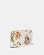 COACH®,KIRA CROSSBODY WITH FLORAL BOUQUET PRINT,Coated Canvas/Smooth Leather,Brass/Chalk,Angle View
