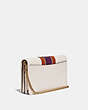 COACH®,CALLIE FOLDOVER CHAIN CLUTCH WITH VARSITY STRIPE,Leather,Mini,Brass/Chalk Multi,Angle View