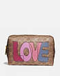 COACH®,LARGE BOXY COSMETIC CASE IN SIGNATURE CANVAS WITH LOVE PRINT,pvc,Medium,Brass/Tan Pink Multi,Front View