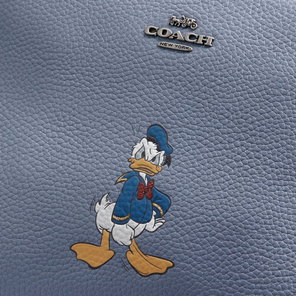 Pochette Disney X Coach Charlie avec motif Donald Duck
