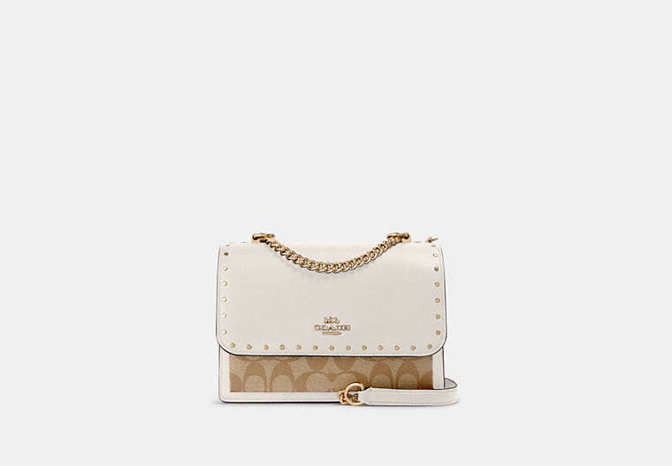 COACH®,KLARE CROSSBODY IN SIGNATURE CANVAS WITH RIVETS,pvc,Medium,Anniversary,Gold/Light Khaki Multi,Front View image number 0