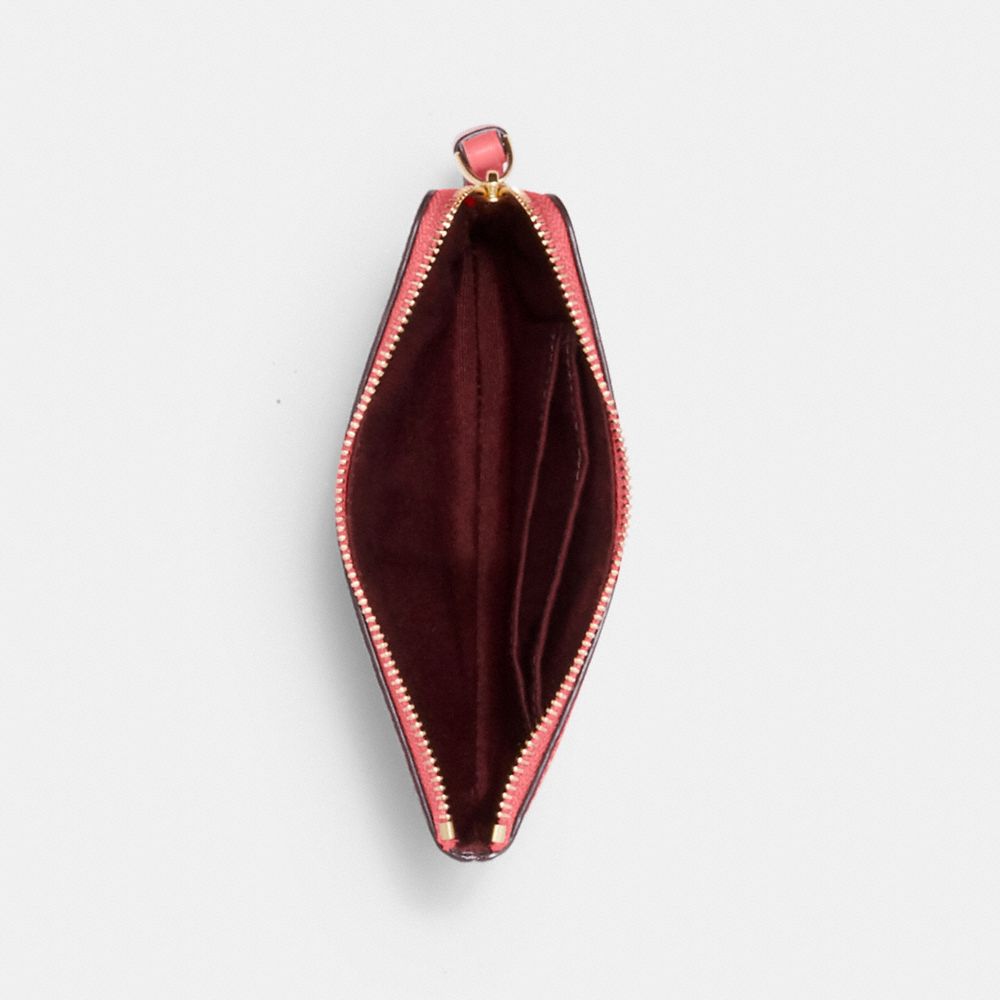 Corner Zip Wristlet In Signature Canvas