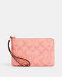 COACH®,CORNER ZIP WRISTLET IN SIGNATURE CANVAS,pvc,Mini,Gold/Candy Pink,Front View