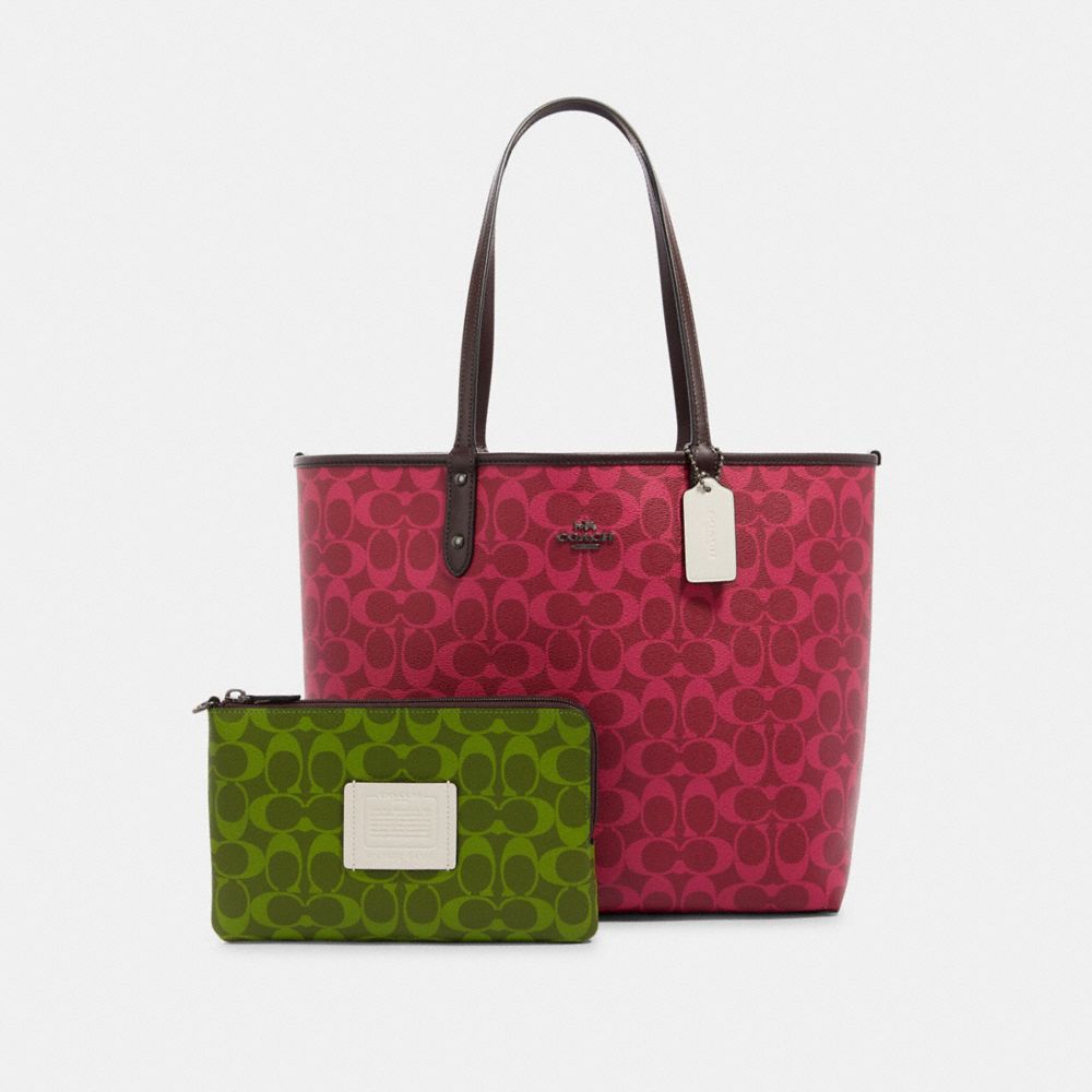 COACH®,REVERSIBLE CITY TOTE IN BLOCKED SIGNATURE CANVAS,pvc,Gunmetal/Magenta Multi,Front View