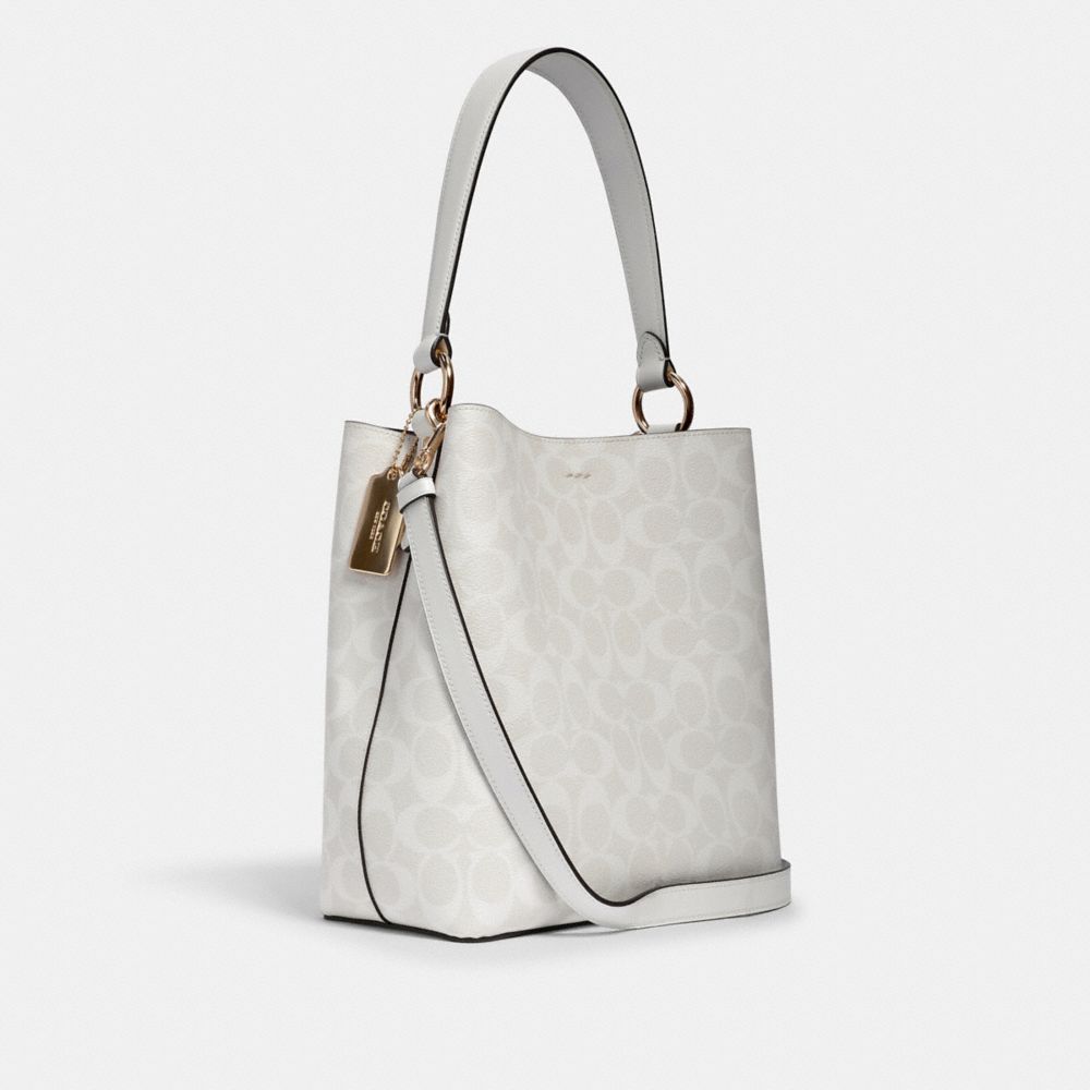 COACH®,TOWN BUCKET BAG IN SIGNATURE CANVAS,Leather,Medium,Gold/Chalk/Glacierwhite,Angle View