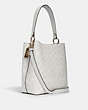 COACH®,TOWN BUCKET BAG IN SIGNATURE CANVAS,Leather,Medium,Gold/Chalk/Glacierwhite,Angle View