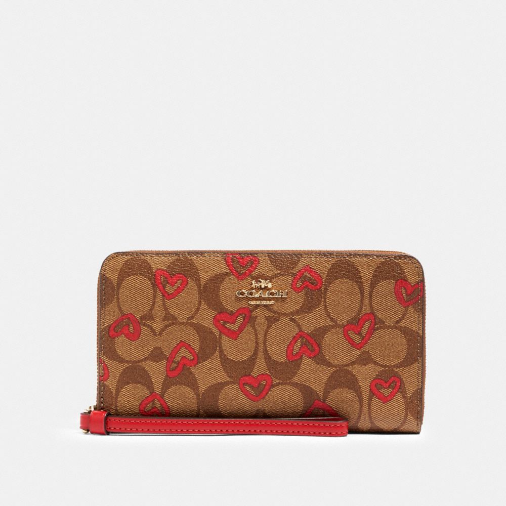 Coach large phone wallet in signature canvas sale