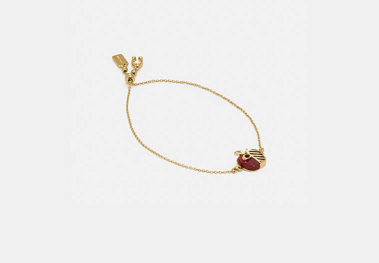 COACH®,APPLE SLIDER BRACELET,Plated Brass,Gold/Red,Front View