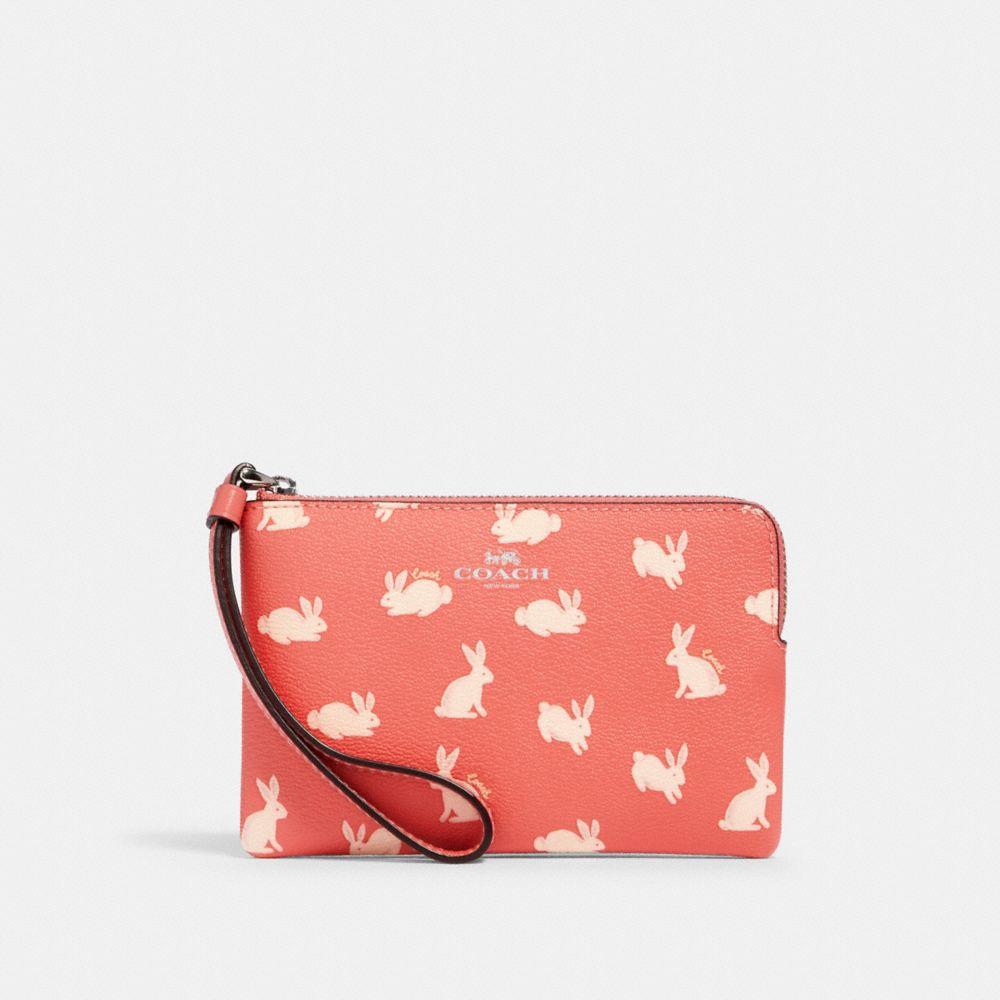 Wristlet à zip en coin avec imprimé lapin et écriture