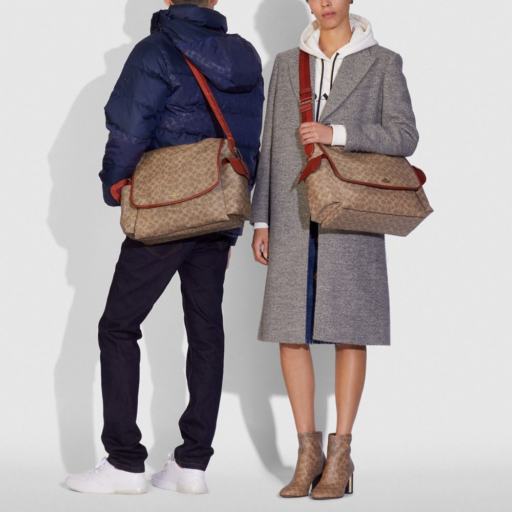 COACH®: Baby Messenger Bag In Signature Canvas